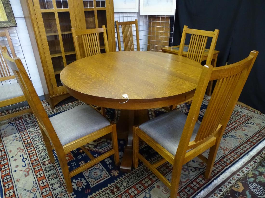 STICKLEY DINETTE, TABLE AND 6 CHAIRS: FROM THE "MISSION COLLECTION". INCLUDES TWO LEAVES. 46"DIA., (2) 15" LEAVES