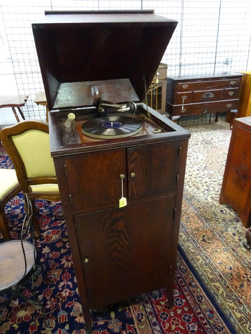 FLOOR STANDING VICTROLA PLAYER: IN WORKING CONDITION WITH RECORDS