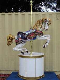 CAROUSEL HORSE BY DENNIS CLIFTON: STUNNING HAND-BUILT AND PAINTED CAROUSEL HORSE ON DRUM PEDESTAL. HORSE LENGTH IS 64". OVERALL HEIGHT IS 101".