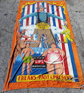 JOHNNY MEAH SIDESHOW BANNER: CIRCUS UNIQUE - FREAKS PAST AND PRESENT "AS SEEN IN LIFE MAGAZINE". LARGE DOUBLE BANNER SIGNED BY MEAH. IRON HOOK ATTACHMENTS. SOME TATTERING TO THE LOWER LEFT CORNER. 10'X18'