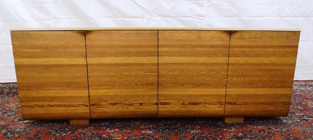 DANISH CREDENZA-SIDEBOARD: INTEGRATED CURLED HANDLES ON DOOR. FINISHED BACK DISPLAYS WELL IN AN OPEN ROOM. 79"W, 18"D, 29"H