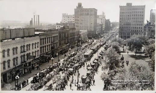 EDWARD J. KELTY (AMERICAN, 1888-1967) PHOTOGRAPH: LARGE FORMAT, ORIGINAL KELTY PHOTOGRAPH DEPICTING HAGENBECK-WALLACE CIRCUS STREET PARADE, TERRE HAUTE, INDIANA, MAY 17TH, 1934. DOUBLE RUBBER INK STAMP ON VERSO. 12"X20"