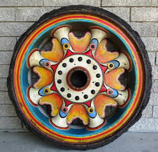 ROYAL AMERICAN SHOWS WAGON WHEEL: ORIGNAL WHEEL, PRESS WAGON. SOLID STEEL CENTER WITH RUBBER TREAD. SUNBURST DESIGN. WEAR CONSISTENT WITH AGE AND USE. 36"