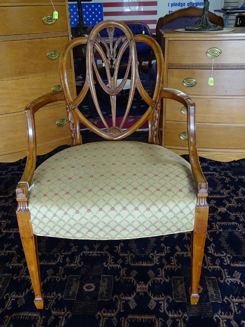 "PRINCES PATTERN" ARM CHAIR AFTER RICHARD GILLOW: BEAUTIFUL TRADITIONAL GEORGE III CHAIR. NEWLY UPHOLSTERED CHAIR FERATURING PIERCED SHIELD BACK, PRINCE OF WALES PLUME AND CARVED DRAPERY SWAGS, MOLDED ARM REST ON DOWN-SWEPT SUPPORTS.