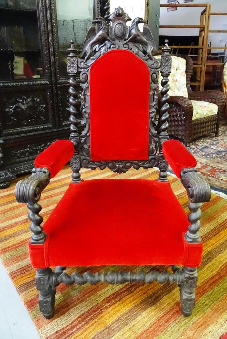 19TH C. FRENCH CARVED THRONE CHAIR: BLACK FOREST, HEAVILY CARVED WITH GOTHIC MOTIF.