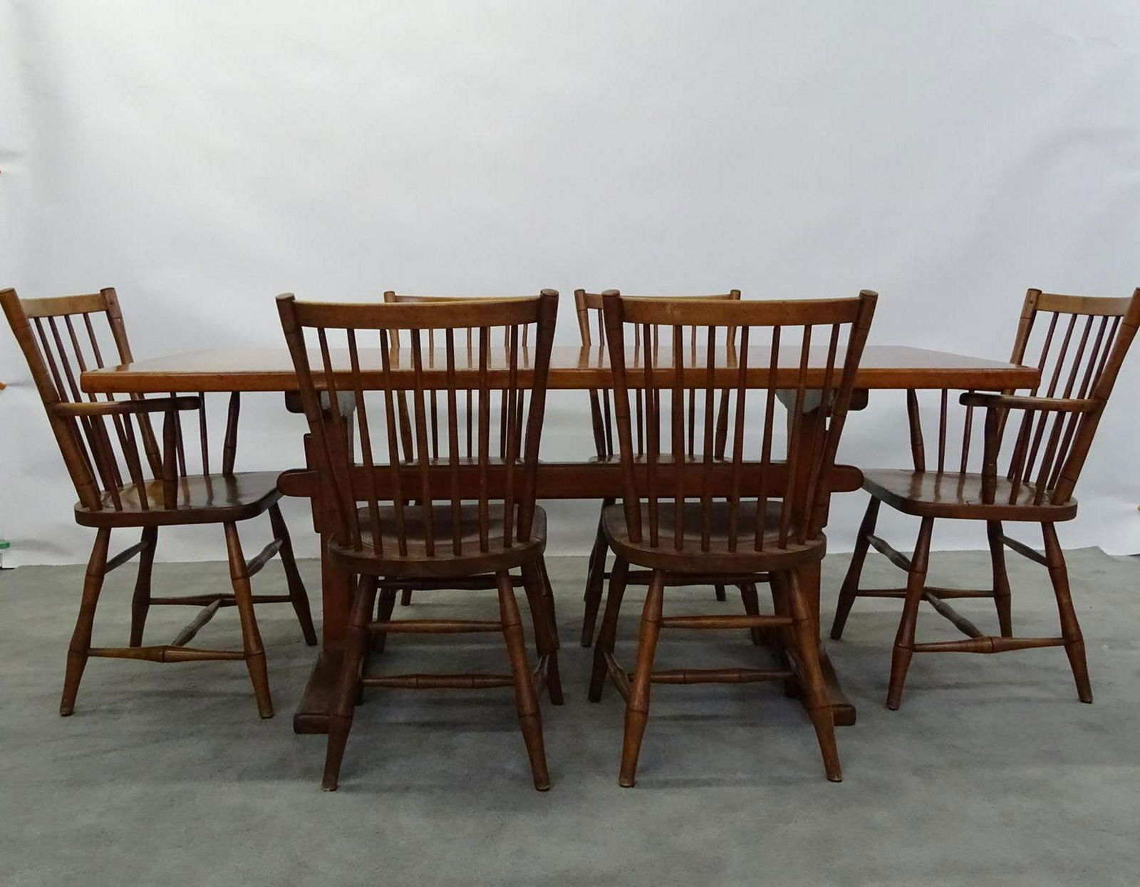 L. & J.G. STICKLEY DINING TABLE AND CHAIRS: ORIGINAL LEOPOLD STICKLY, 1956, WITH PAPER LABEL. TRESTLE TABLE AND 6 CHAIRS. TABLE 72L, 32W, 29H