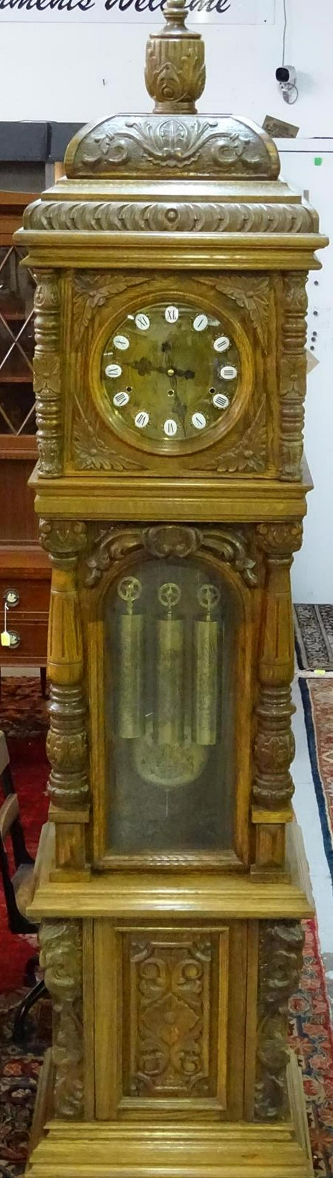 GAZO "SAN LUIS REY" GRANDFATHER CLOCK: A BEAUTIFUL EXAMPLE. HAND MADE, HAND CARVED CUSTOM GRANDFATHER CLOCK. HAS ORIGINAL PAPERWORK. IN WORKING CONDITION AT TIME OF SALE.