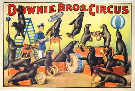 DOWNIE BROS. CIRCUS POSTER: ONE SHEET, ERIE LITHO, 1930'S. FEATURING TRAINER WITH A BAND OF SEALS. LINEN BACKED, PROFESSIONALLY RESTORED. CLOSED TEARS, RESTORED LOSS AT MARGINS. 28"X41"