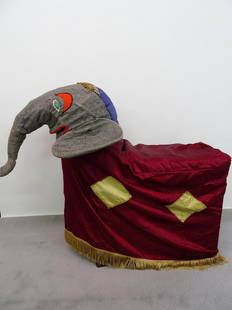 BABY ELEPHANT BEND-OVER PROP - LECLAIR FAMILY: ORIGINALLY CRAFTED BY JACK LECLAIR (RBBB CIRCUS) IN THE 1920'S, THIS PROP WAS LATER USED BY HIS SON JACKIE LECLAIRE IN THE BEND-OVER ACT. INCLUDES PROP AND TAYLOR TRUNK, LABELED "JACKIE LECLAIR,