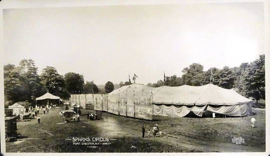 EDWARD J. KELTY (1888-1967) PHOTOGRAPH: ORIGINAL KELTY PHOTOGRAPH OF SPARKS CIRCUS EXTERIOR AND BANNER LINE, PORT CHESTER, N.Y., 1930. STAMP ON VERSO.
