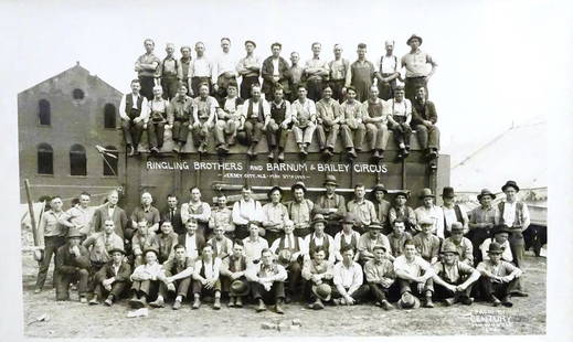 EDWARD J. KELTY (1888-1967) PHOTOGRAPH: ORIGINAL KELTY PHOTOGRAPH OF THE 1929 RBBB CIRCUS WORKING CREW AROUND WAGON. STAMP ON VERSO