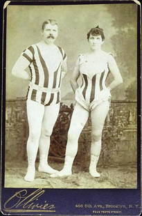 GEORGE TESTO, FANNY ONRI, 1890'S CABINET CARD: ONRI FAMOUS FOR FEATS OF STRENGTH HANGING ON THE TRAPEZE BY HER TEETH AS WELL AS HER HAIR. TESTO PULLS AGAINST TWO HORSES EACH PERFORMANCE AS NOTED IN GRAPHITE ON REVERSE.