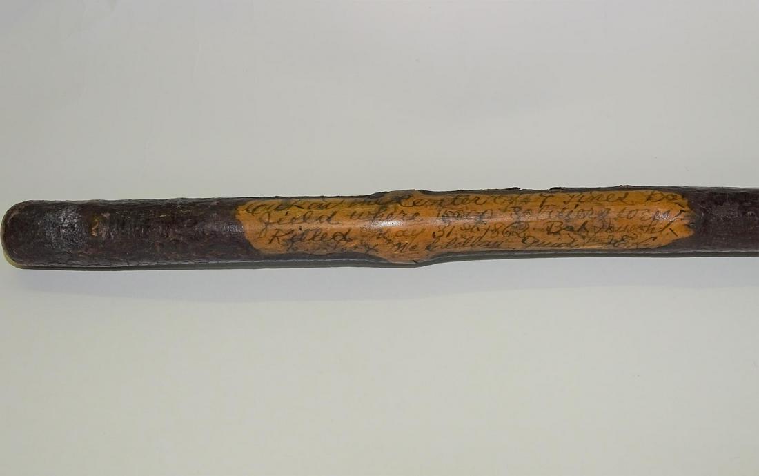 BATTLE OF SEVEN PINES RELIC CANE: TWIG CANE WITH INK TEXT READING "CUT IN THE CENTER OF 7 PINES BATTLE FIELD WHERE 15,000 SOLDIERS WERE KILLED MAY 31, 1862. FOUGHT BY LEE AND MCCLELLAN, GUIDE L.E. LYNE. REPRESENTS THE UPPER PORTION OF