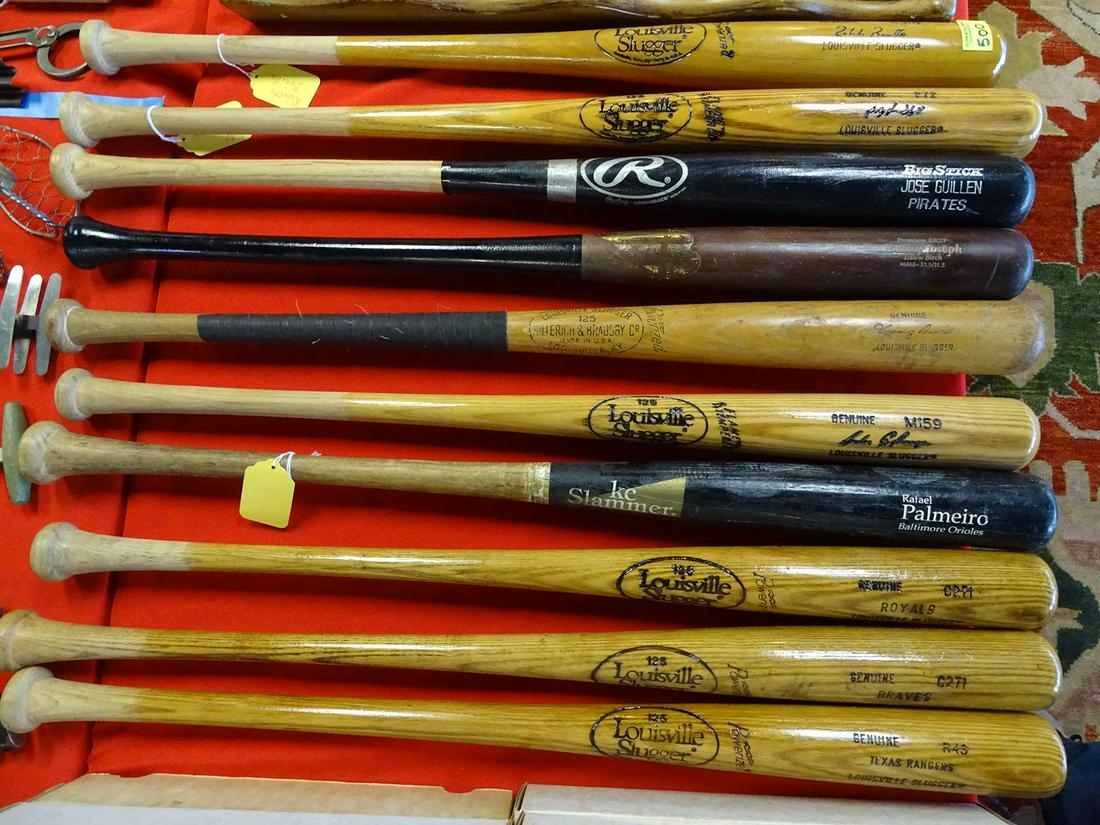 10 ASSORTED BASEBALL BATS: TEAM BATS INCLUDING RANGERS, BRAVES, ROYALS. RAFAEL PALMEIRO, ANDRES GALLARAGA, TOMMY DAVIS, TOMMY JOSEPH, JOSE GUILLEN, ANDY VAN SLYKE, BOBBY BONILLA.