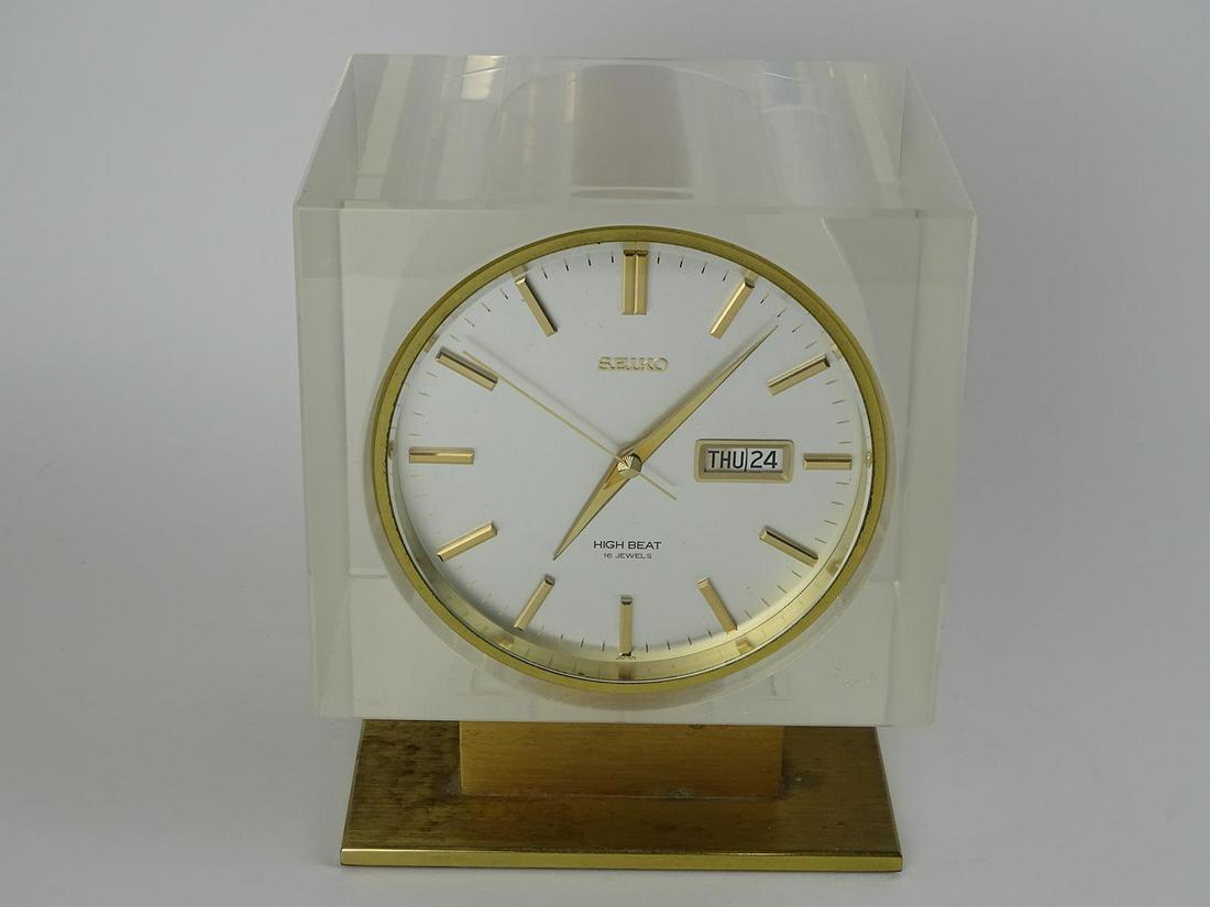 RARE - SEIKO HIGH BEAT MANTEL CLOCK: 16 JEWEL SEIKO CLOCK SET IN LUCITE BLOCK WITH ORIGINAL CASE. CLOCK HAS NOT BEEN TESTED. 6"X5"X7.5"