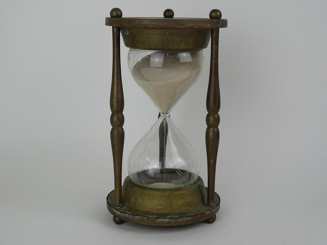 BRASS HOURGLASS: HAS NOT BEEN TESTED AS TO THE ACCURACY OF EXACTLY AN HOUR BUT IS COOL NONETHELESS. 9"