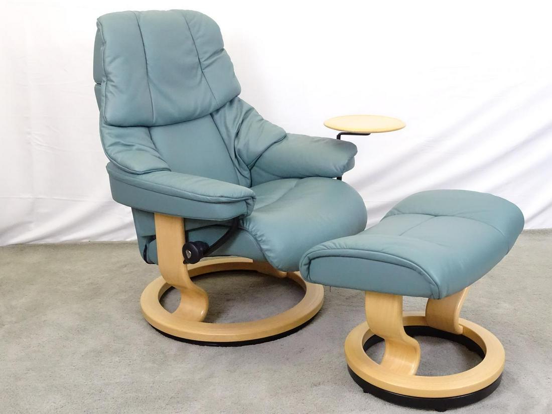 EKORNES STRESSLESS LOUNGE CHAIR WITH OTTOMAN: THIS UNIT IS IN "AS NEW CONDITION". MAPLE STRUCTURE WITH LEATHER IN SEA FOAM GREEN. ARTICULATING TABLE WITH ACCESSORY TO MOVE TO LEFT OR RIGHT SIDE.