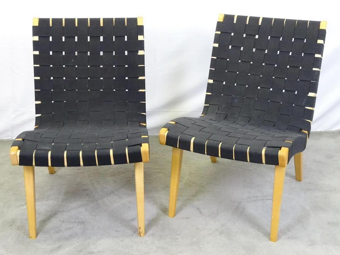 PAIR - JENS RISOM FOR KNOLL LOUNGE CHAIRS: WEBBED SEATING WITH MAPLE FRAMES. BRASS TAGS WITH RISOM SIGNNATURE. RECENT PRODUCTION. EXCELLENT CONDITION. ONE CHAIR WITH TAG. 20"X18", 16" SEAT, 30" BACK.