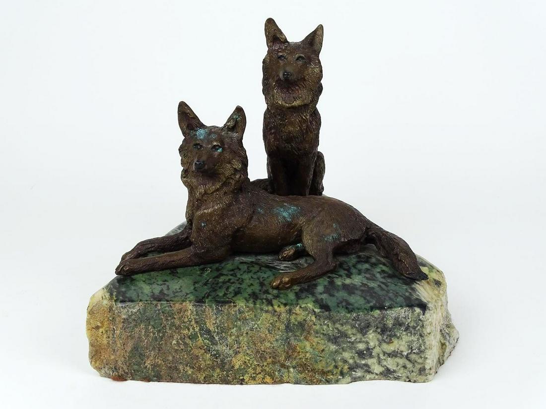 LAURA WOOLSCHLAGER BRONZE SCULPTURE: "SENTRY ROCK", EDITION OF 12, SIGNED AND DATED 1983. MOUNTED ON HEAVY STONE SLAB