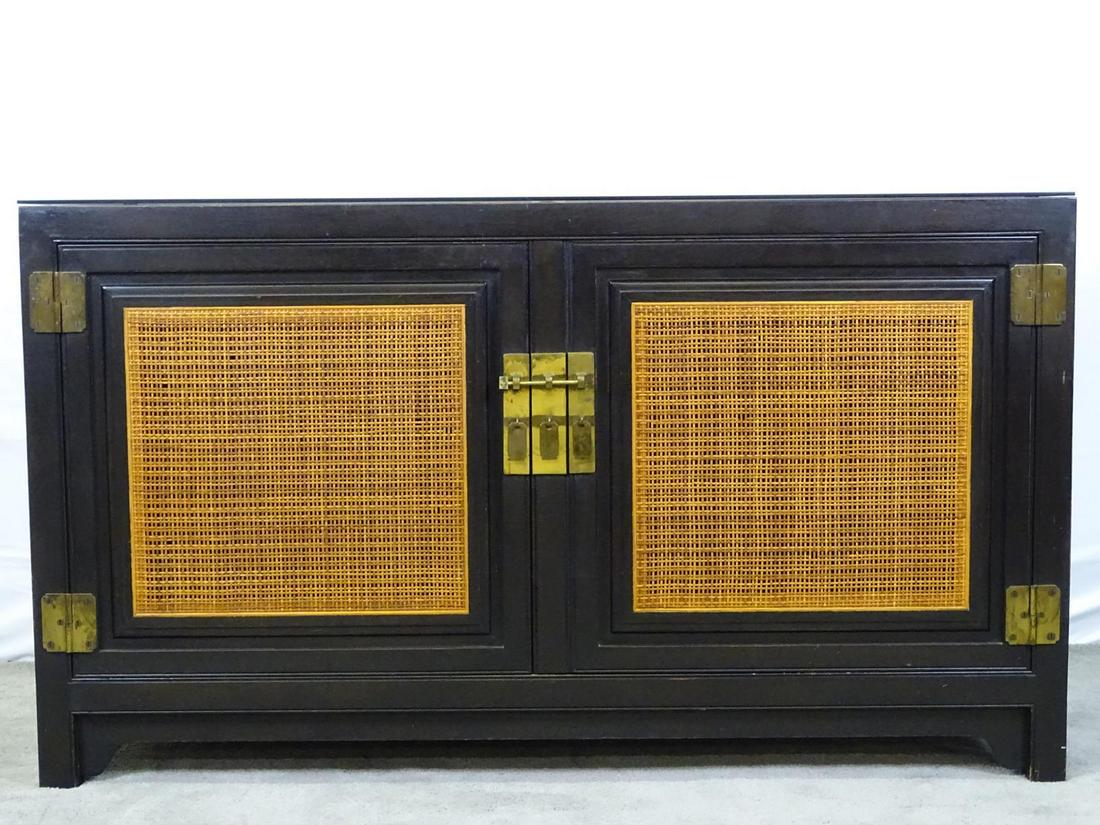 BAKER FURNITURE SIDEBOARD CABINET: GREAT MULTI-PURPOSE CABINET FOR SERVING, MEDIA OR CHEST STORAGE. EBONIZED CABINET WITH SMOKED GLASS TOP, CANE FRONT DOORS AND BRASS FITTINGS. LABELED INTERIOR, DRAWERED. MINOR WEAR. 56"X32"X19"