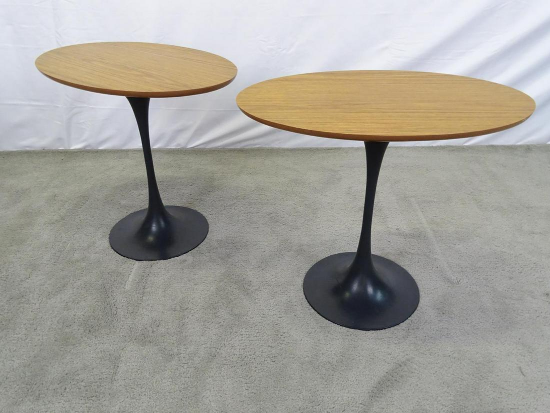 PAIR - SAARINEN-STYLE TULIP BASE SIDE TABLES: HAVING OVAL LAMINATE TOPS WITH EBONIZED TULIP BASES. 15"X23" TOP, 20"H.