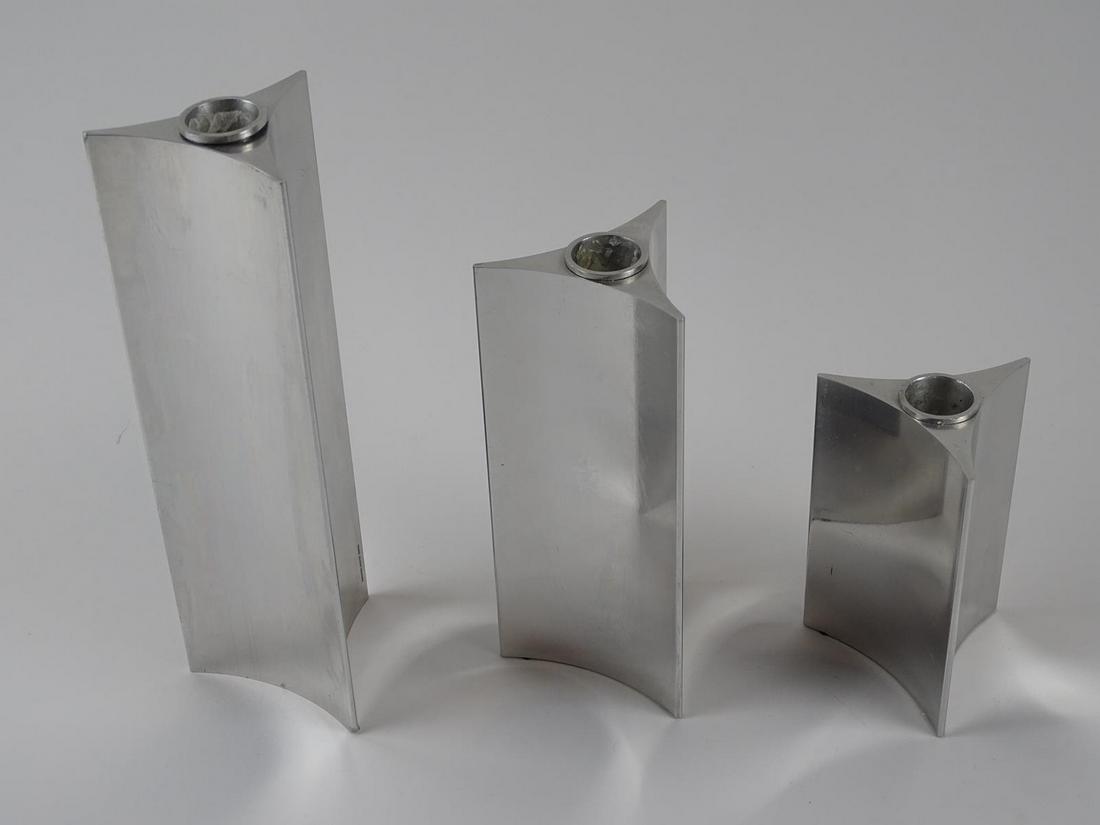 VERNER PANTON GEORG JENSEN CANDLESTICKS: TRIO OF GRADUATED "STARLIGHT" CANDLESTICKS. SIGNED, STAINLESS STEEL. 4.75", 7", 9"