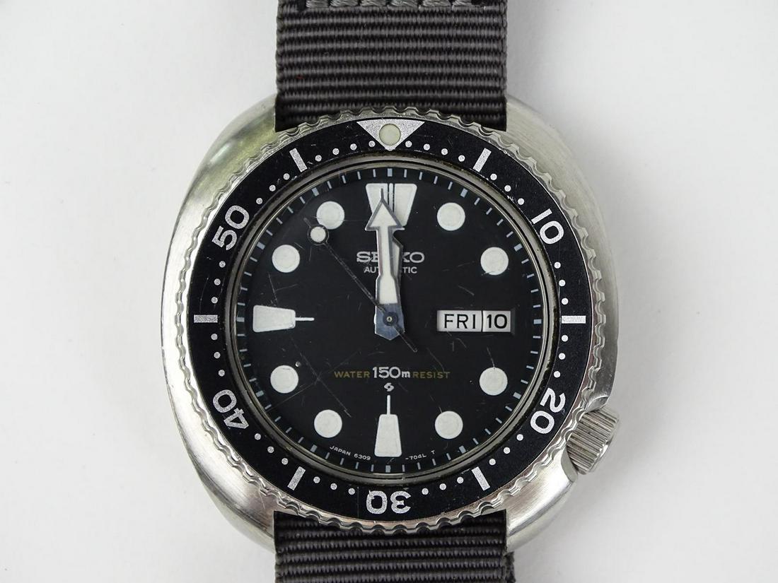 VINTAGE SEIKO MEN'S DIVER'S WATCH: 6309-7049. RUNNING. MULTIPLE SCRATCHES/SCUFFS ON CRYSTAL.