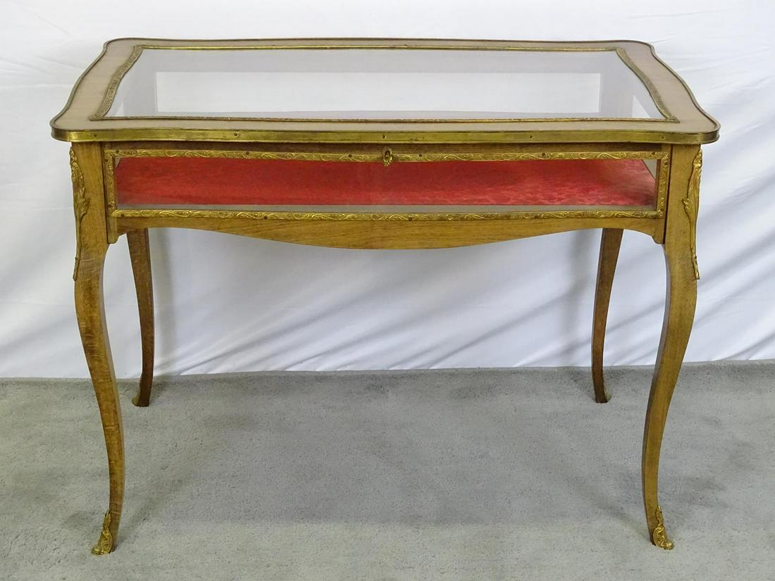 ANTIQUE ORMOLU MOUNTED BIJOUTERIE CABINET: SERPENTINE WITH HINGED TOP. GOOD CONDITION. WITH KEY. 40"X24"X29"