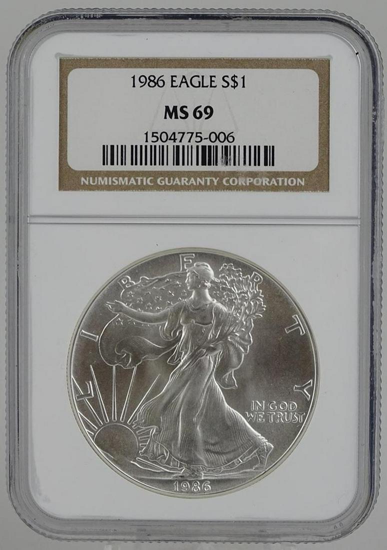 1986 U.S. SILVER EAGLE: MS69 BY NGC. FIRST YEAR OF ISSUE