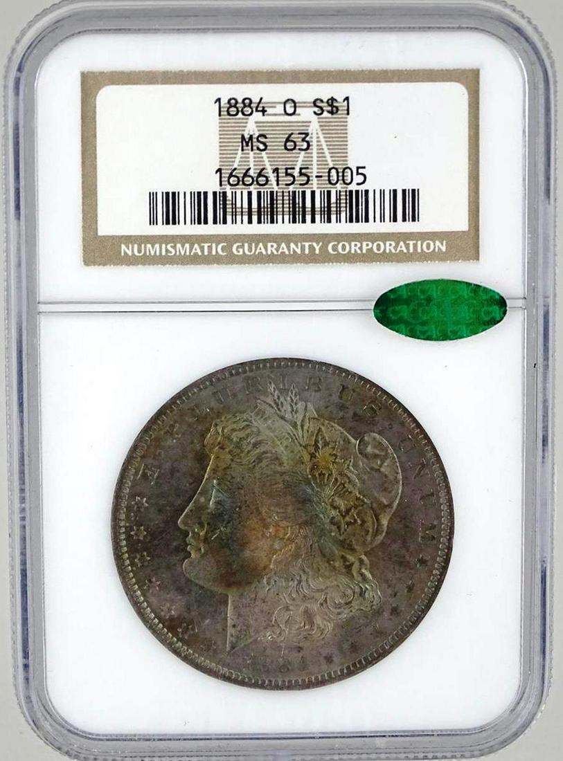 1884-O MORGAN SILVER DOLLAR: OBV. RAINBOW TONED. MS63 BY NGC, CAC