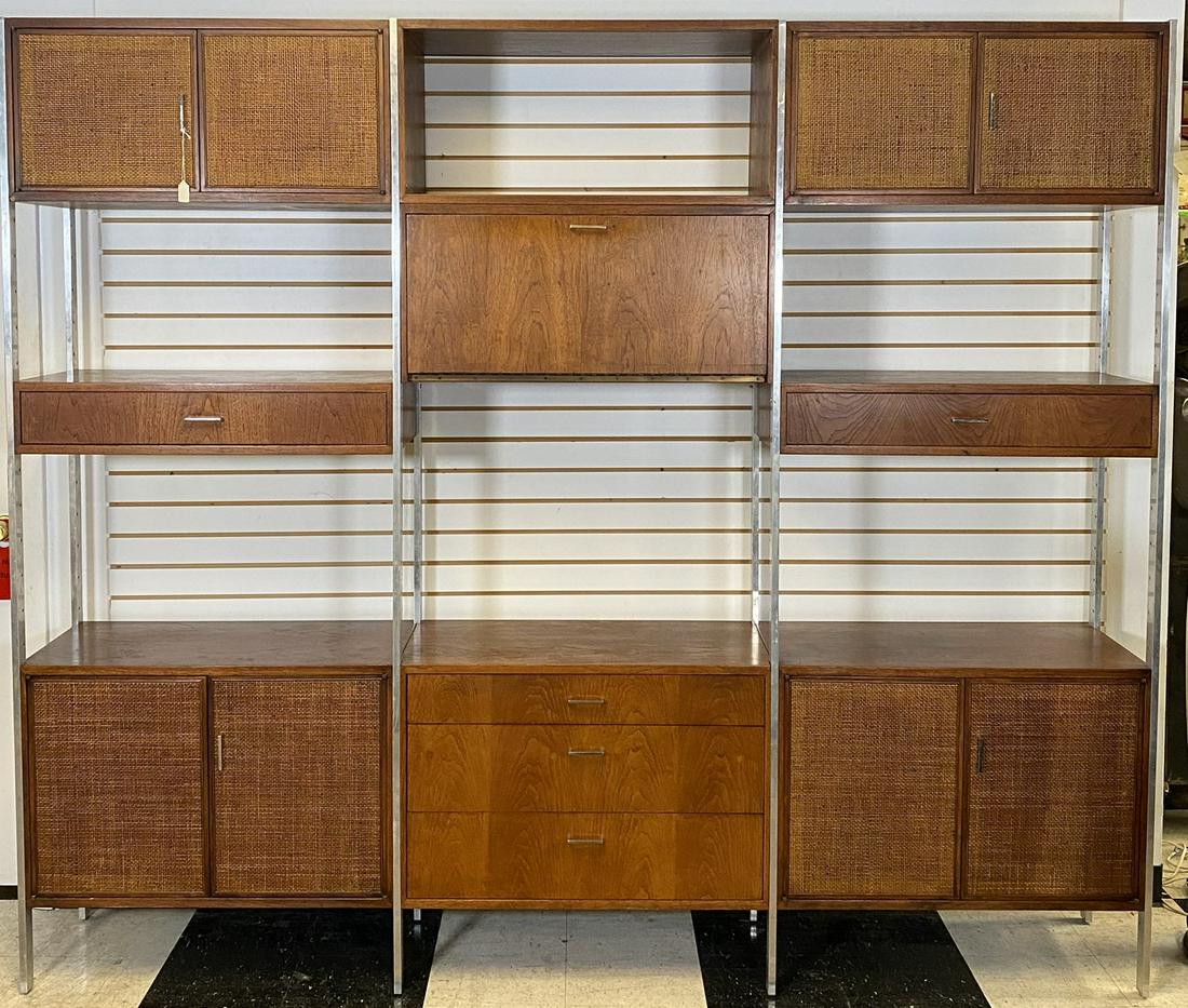 JACK CARTWRIGHT FOR FOUNDERS WALL UNIT: MODULAR WALL UNIT IN WALNUT WITH CANE DOORS. ALUMINUM STRUCTURE WITH MODULAR SECTIONS. WITH EXTRA SHELVES, HARDWARE. 97"W, 16"D, 83"H