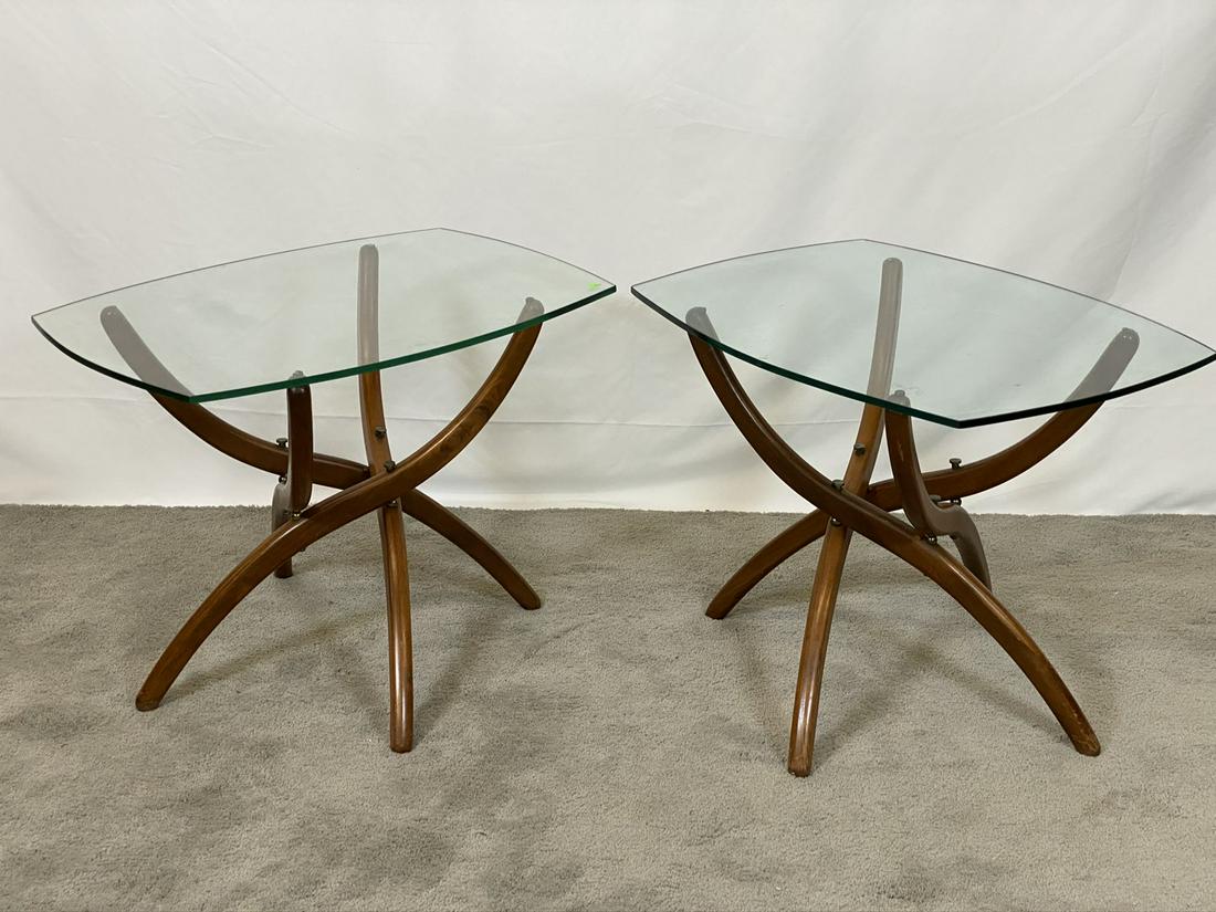 FOREST WILSON SCULPTURAL SIDE TABLES: PAIR, HAVING ARTICULATING BASE WITH GLASS TOPS. 21"H, 27"X20" TOP