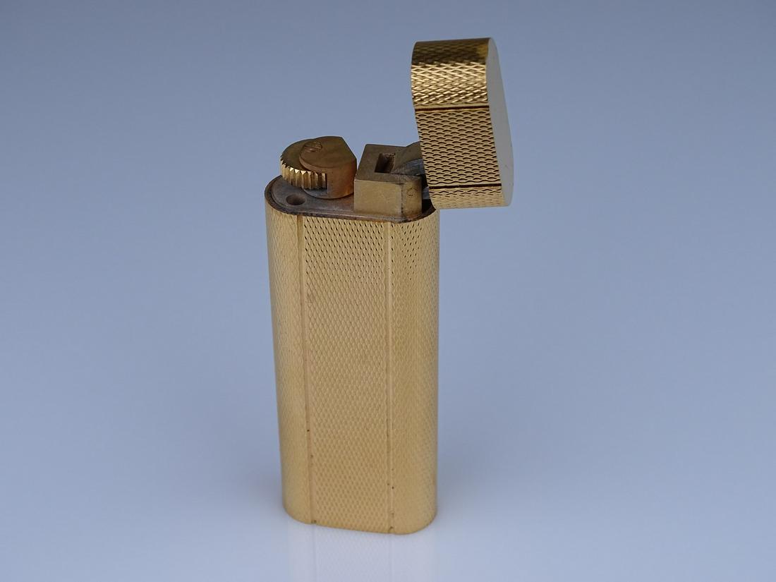 GENUINE CARTIER LIGHTER: SPARKS, FINISH IS BRIGHT. SERIAL NUMBER 74610.