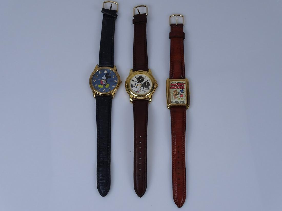 THREE VINTAGE MICKEY MOUSE WRISTWATCHES: NOT RUNNING AND MAY NEED BATTERIES