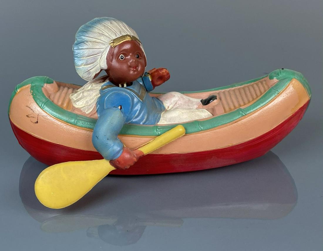 CELLULOID INDIAN IN CANOE TOY: 6"X3"X3"