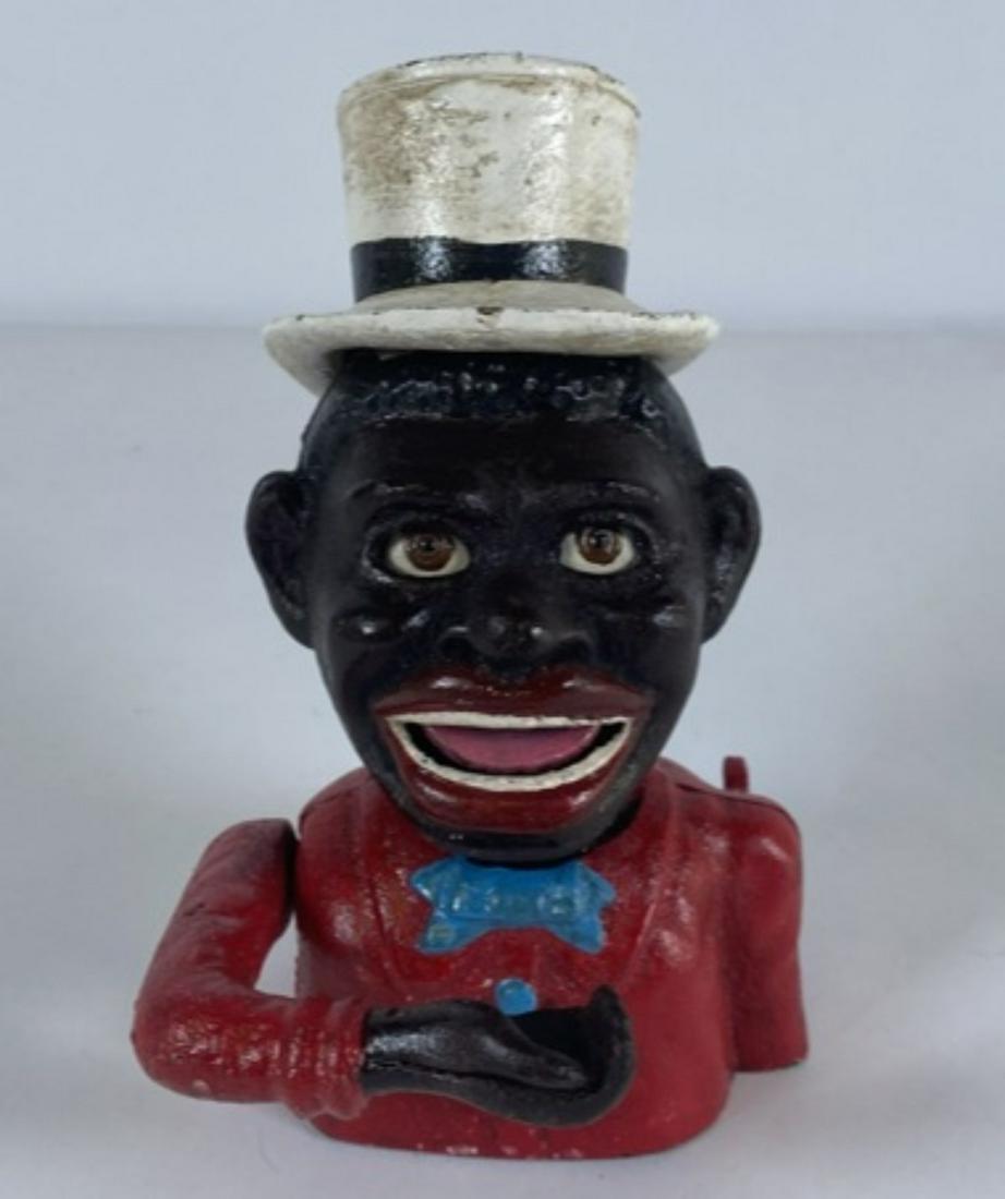 JOHN HARPER JOLLY NEGRO CAST IRON BANK: 20TH C., VERY GOOD CONDITION. 7"H