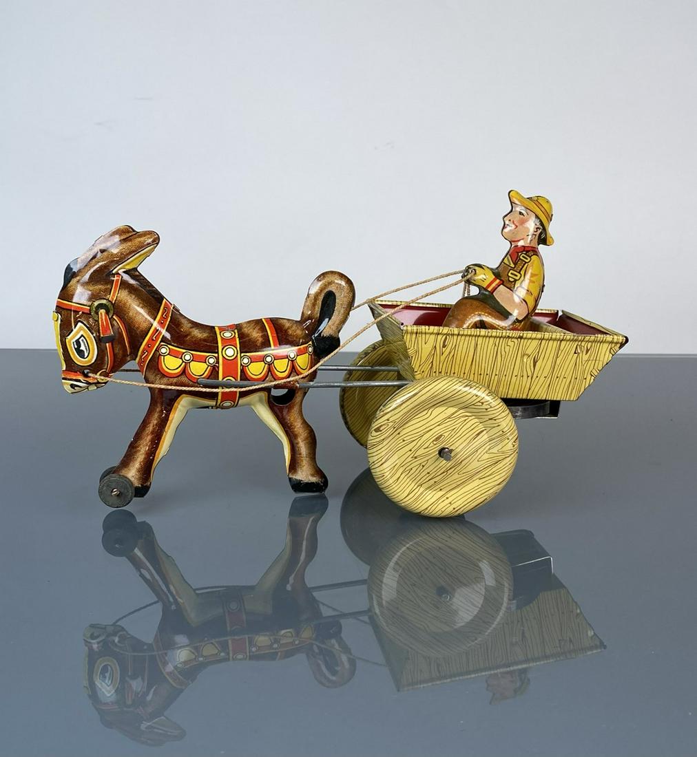 MARX TOYS TIN LITHO DONKEY CART: WITH WIND UP ACTION, ONE WHEEL MISSING KEYWAY. 9"X3"X5"
