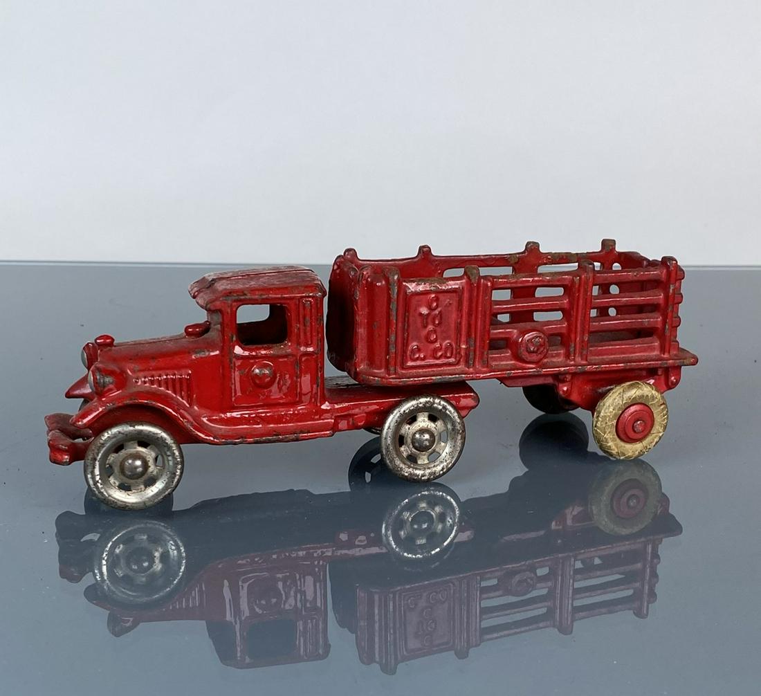 AC WILLIAMS TRACTOR AND STAKE TRAILER: CAST IRON. 8"X2"X2"