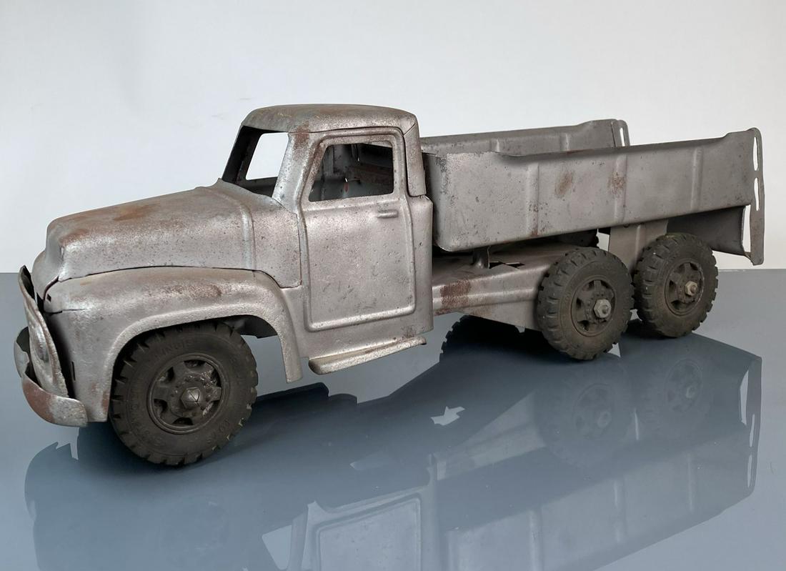 LARGE BUDDY-L TRUCK: PAINT STRIPPED, MINOR PITTING. 22"X6"X7"