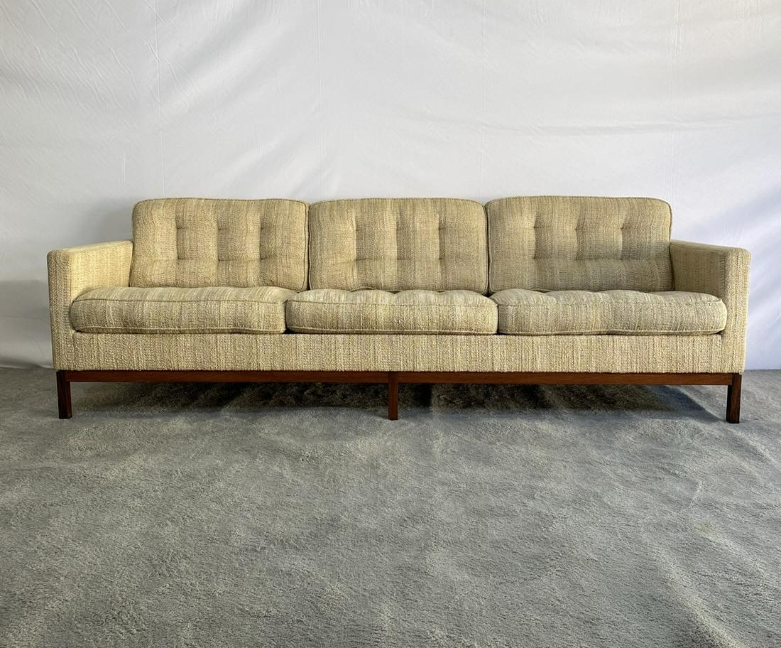 FLORENCE KNOLL VINTAGE SOFA: BUTTON TUFTED SOFA ON ROSEWOOD BASE. C.1955. EXCELLENT VINTAGE CONDITION WITH LABEL. 90"X32"X23"