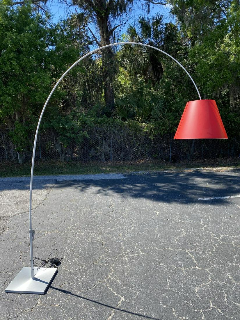 PAOLO RIZZATTO FOR LUCEPLAN FLOOR LAMP: LADY COSTANZA" LARGE ARCING LAMP CAN PIVOT OR EXTEND TO CENTER OVER ANY AREA. BRUSHED METAL, RED PLASTIC SHADE. GOOD COND. BASE CENTERLINE TO LAMP CENTERLINE FULLY EXTENDED IS 72". HEIGHT IS 96