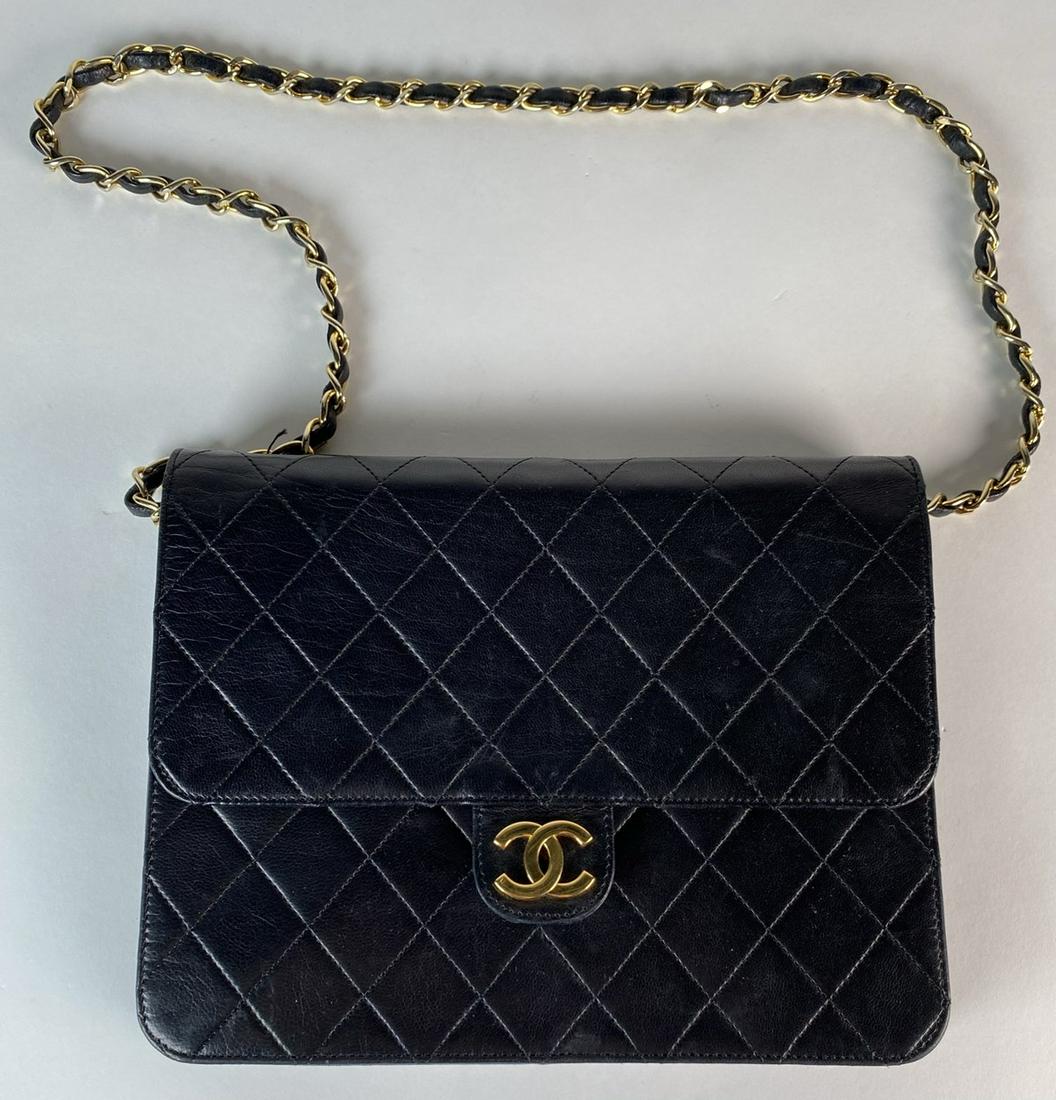 CHANEL HANDBAG: BLACK QUILTED CLASSIC COCO FLAP SHOULDER BACK. EXCELLENT CONDITION. PURSE DOES NOT SNAP AT CLOSURE. INCLUDES DUST BAG. 6.75"X8.75"