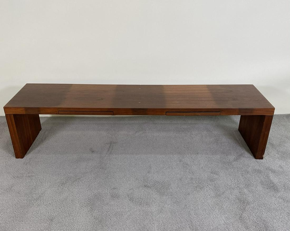 MILO BAUGHMAN FOR THAYER BENCH: LONG WALNUT BENCH WITH DRAWERS. INCONSISTENT FINISH/FADING. 60"X15"X14"