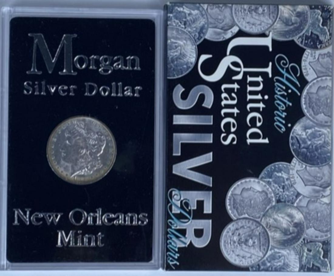 1883-O MORGAN SILVER DOLLAR: IN SPECIAL ACRYLIC NEW ORLEANS MINT HOLDER AND OUTER BOX.