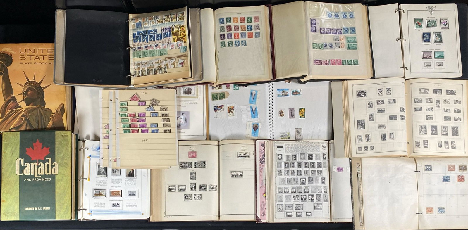 DISCOVERY POSTAGE STAMP COLLECTION: 45 POUNDS. CANADA AND PROVINCES, U.S. COMMEMORATIVE, U.S. PLATE, INTERNATIONAL, SCOTT'S MODERN, CAMBODIA, ULTRA ALBUM. SOME PARTIAL.