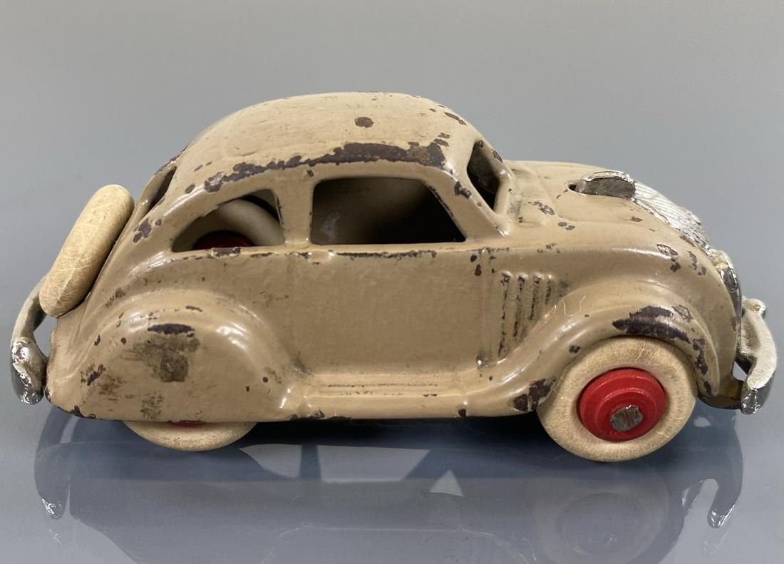 ARCADE AIRFLOW SEDAN: CAST IRON IN BROWN. ORIGINAL WITH PAINT LOSS. 4"