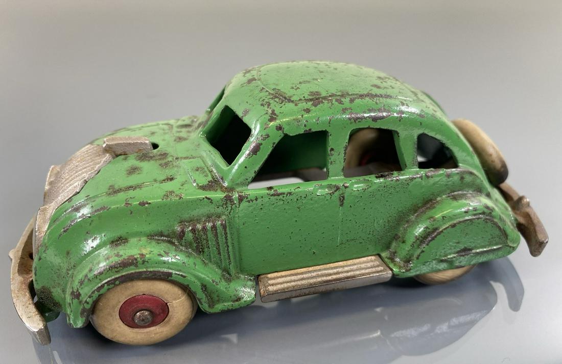 ARCADE AIRFLOW SEDAN: CAST IRON IN GREEN. ORIGINAL WITH WEAR. 6"