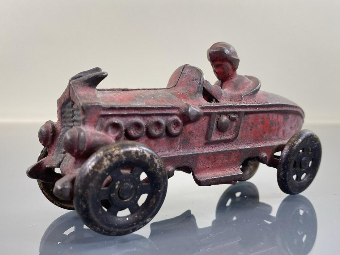 AC WILLIAMS BOAT TAIL RACER: CAST IRON. ORIGINAL WITH WEAR. 5.25"