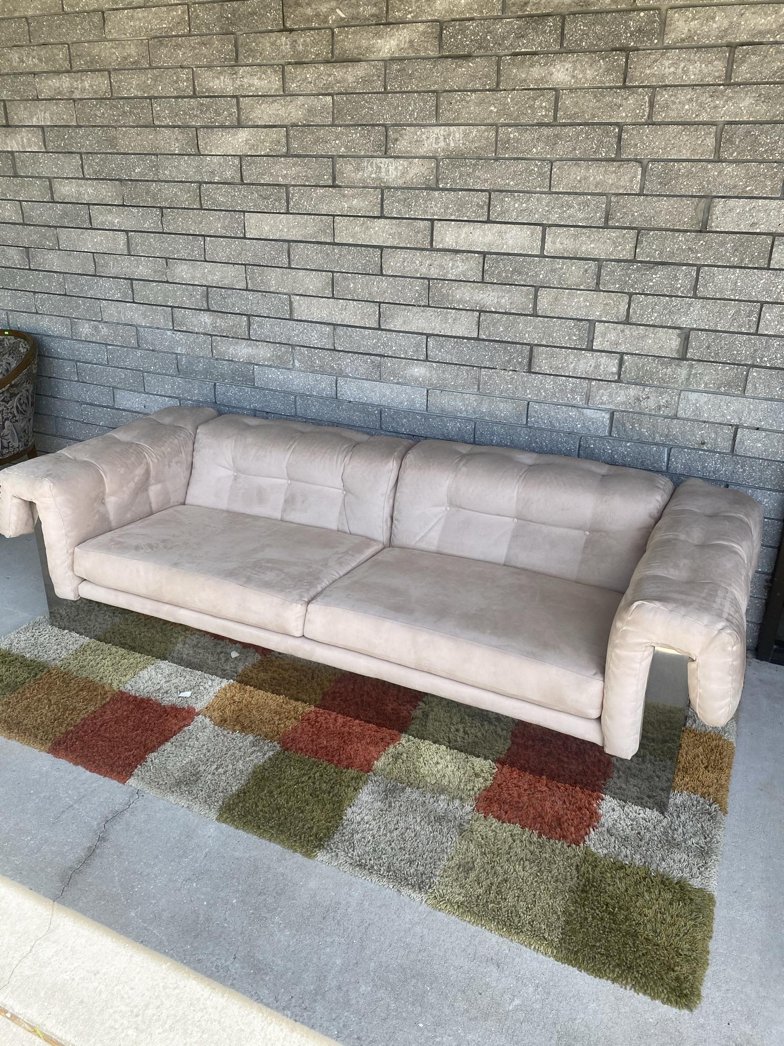 MILO BAUGHMAN FOR THAYER COGGIN SOFA: C.1968. CHROME CLAD. ONE OWNER. RE-UPHOLSTERED. VERY CLEAN UNIT. CHROME CLADDING HAS SCATTERED IMPRESSIONS THAT ARE NOT NOTICEABLE UNLESS DIRECTLY LIT. A NICE EXAMPLE. 94"X37". 24"BACK, 16" SEAT.