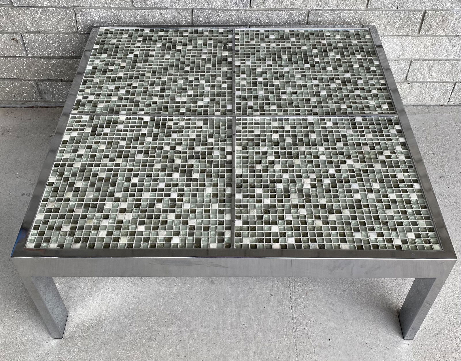 MILO BAUGHMAN (ATTR.) MOSAIC COCKTAIL TABLE: NICE LARGE EXAMPLE WITH BRIGHT CHROME STRUCTURE AND EARTH-TONED GLASS AND CERAMIC TILE MOSAIC TOP. 38"TOP, 15"H